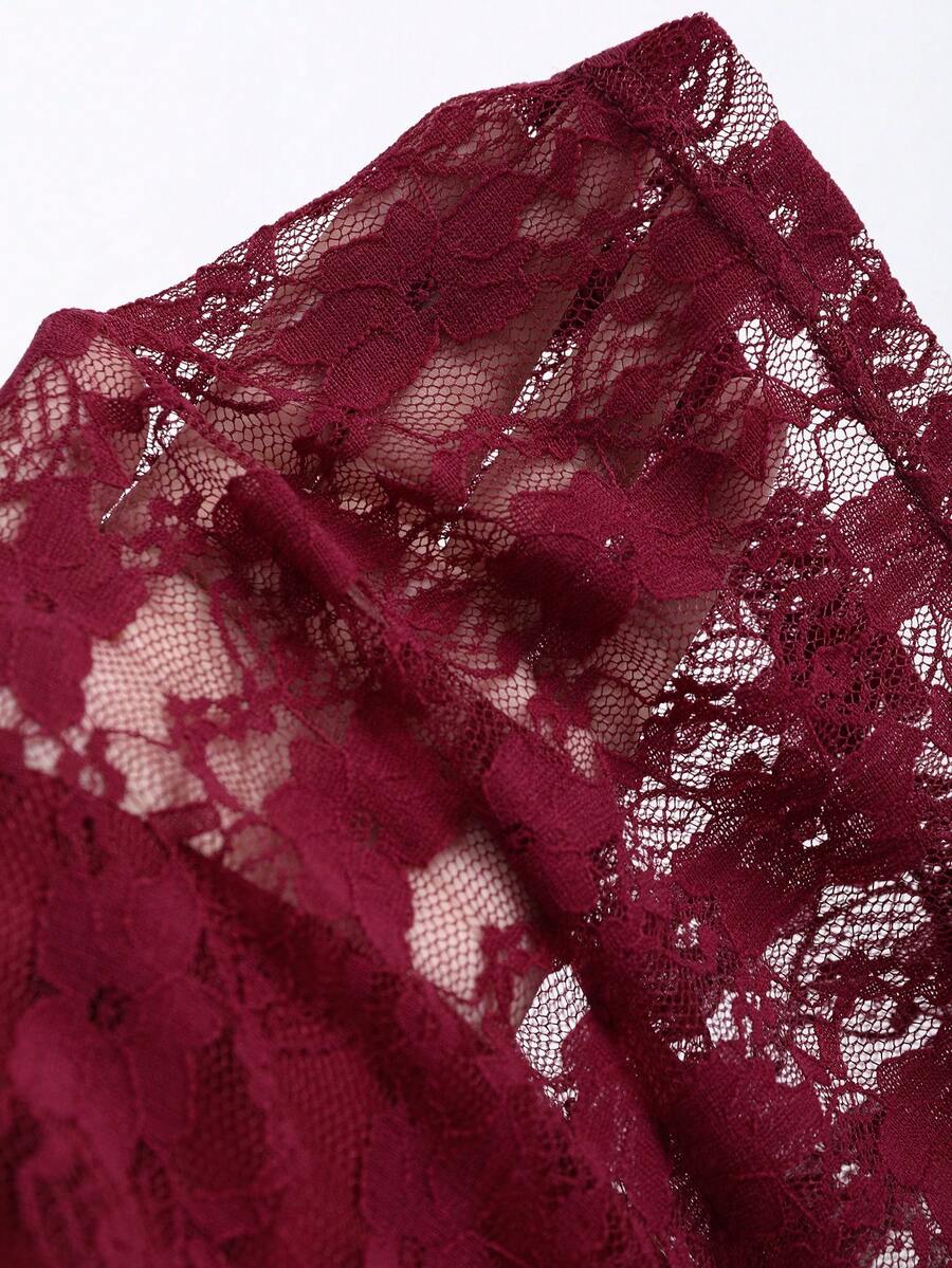 Women's solid lace halter top featuring a backless slim fit design with semi-sheer lace detail.