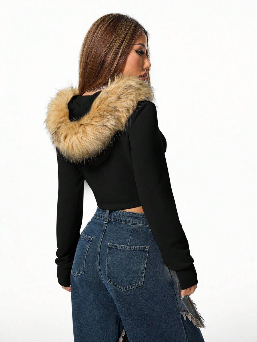 Front view of women's black zip-up hooded crop top with long sleeves and fuzzy faux fur fleece details