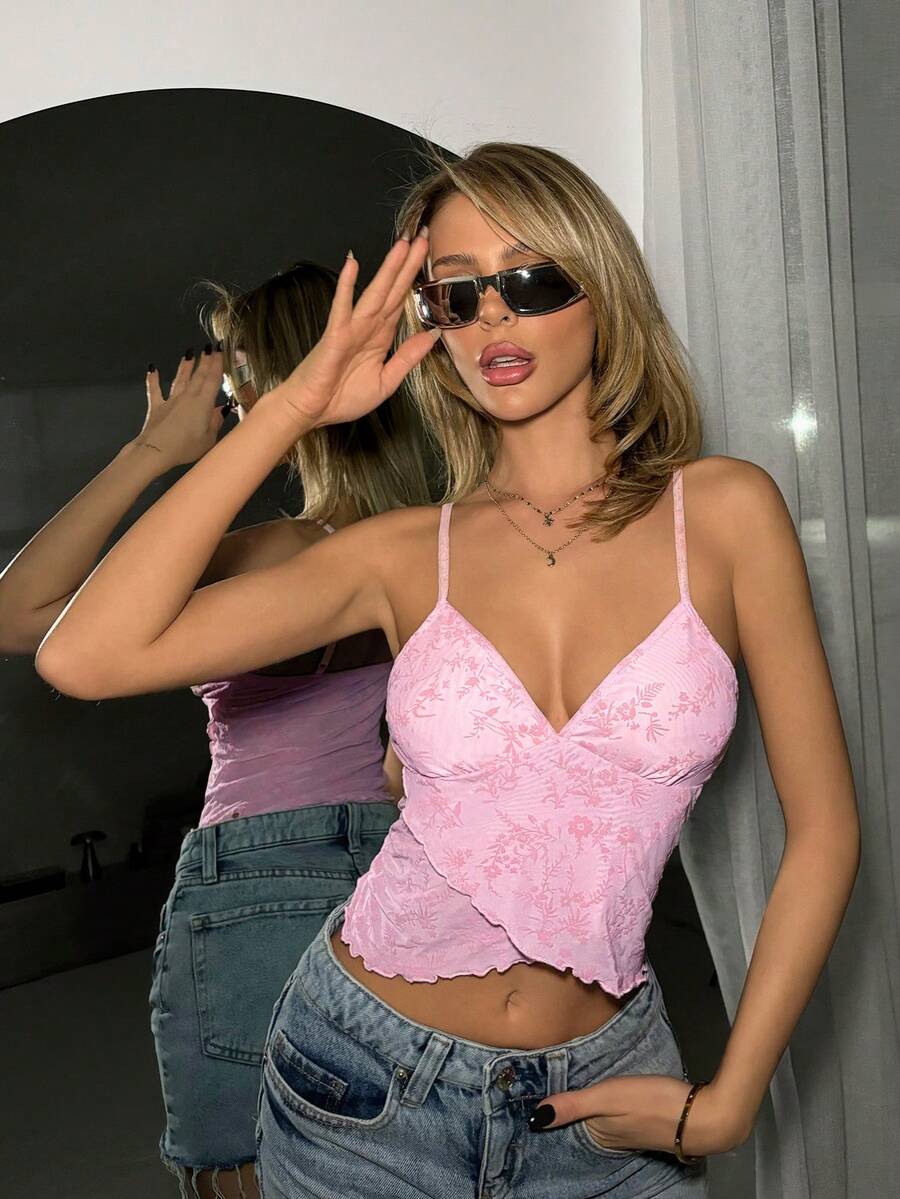 Women's cropped floral flocked camisole with spaghetti straps, backless styling, lettuce trim, asymmetrical hem, and slim fit