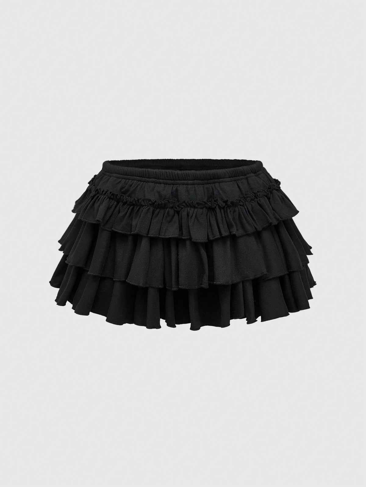 Women's low waist tiered mini skirt featuring ruffled hem layers in knitted stretch fabric.