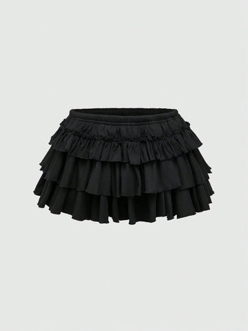 Women's low waist tiered mini skirt featuring ruffled hem layers in knitted stretch fabric.