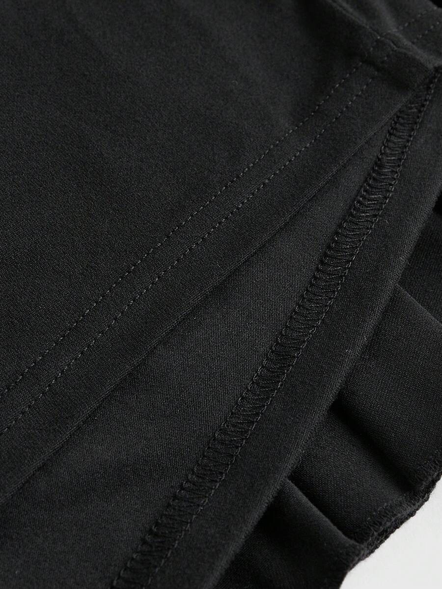 Women's low waist tiered mini skirt featuring ruffled hem layers in knitted stretch fabric.