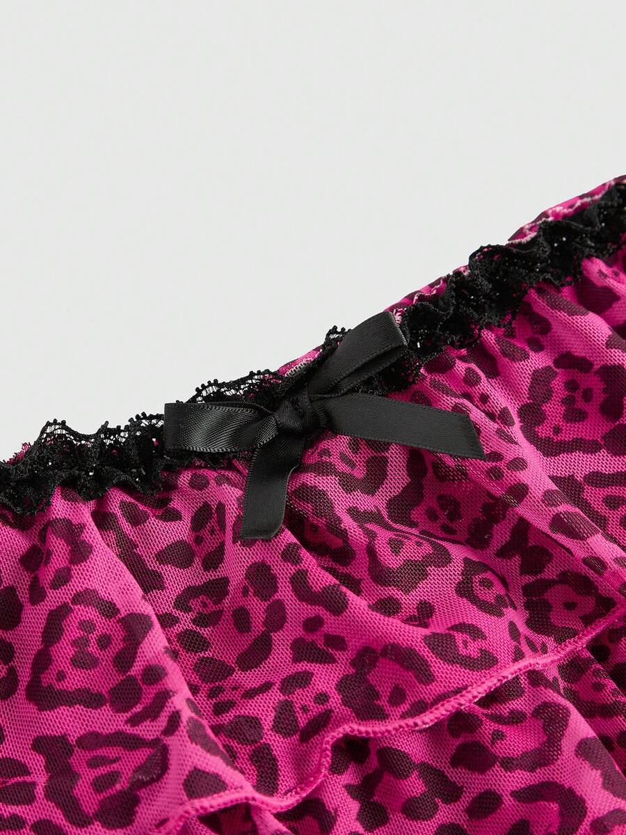 Y2K leopard print two-piece outfit with strapless bandeau top and ruffle mini shorts, featuring contrast lace and a slim fit