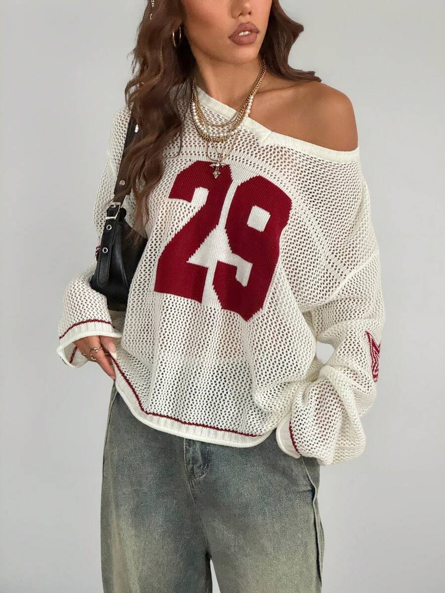 Women's oversized long sleeve knit pullover sweater with round neck, drop shoulder design, and front pocket detail.