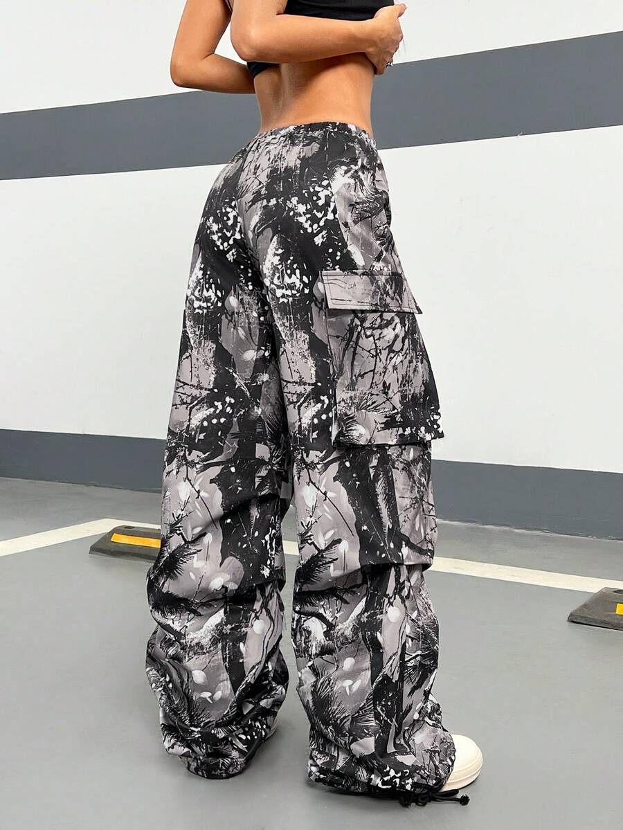 Women's high waist wide leg cargo pants featuring a black and white tree branch print and adjustable drawstring closure.