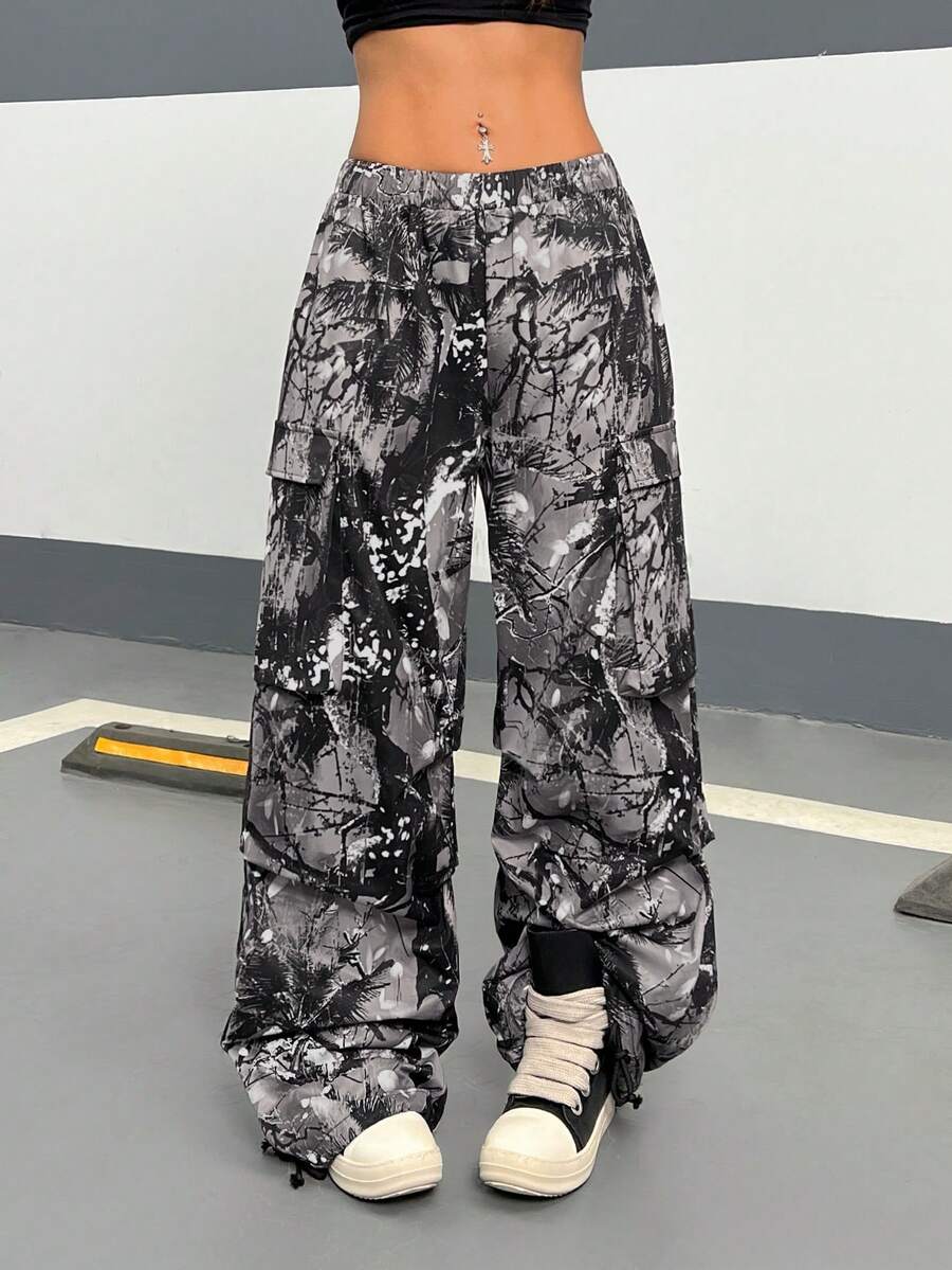 Women's high waist wide leg cargo pants featuring a black and white tree branch print and adjustable drawstring closure.