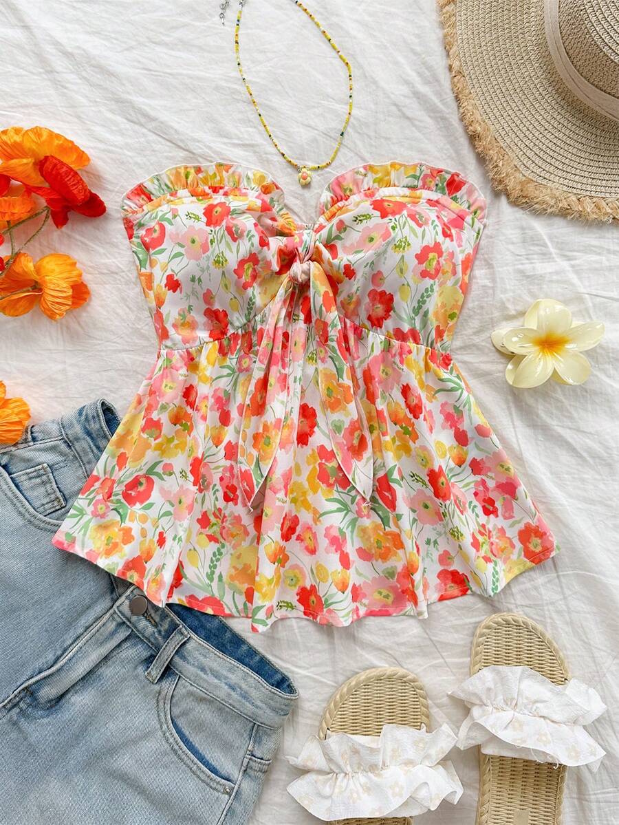 Women's woven strapless bandeau top in multicolor floral print featuring ruffle trim, frill details, and a flared hem.