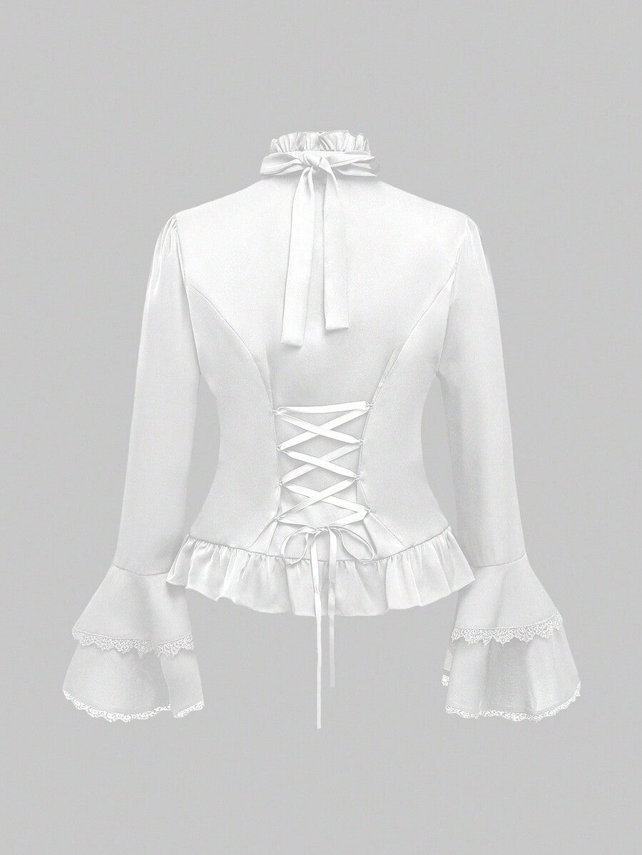 Vintage gothic style women's blouse with stand collar, detachable ruffled bow tie, gem pendant, and flare sleeves