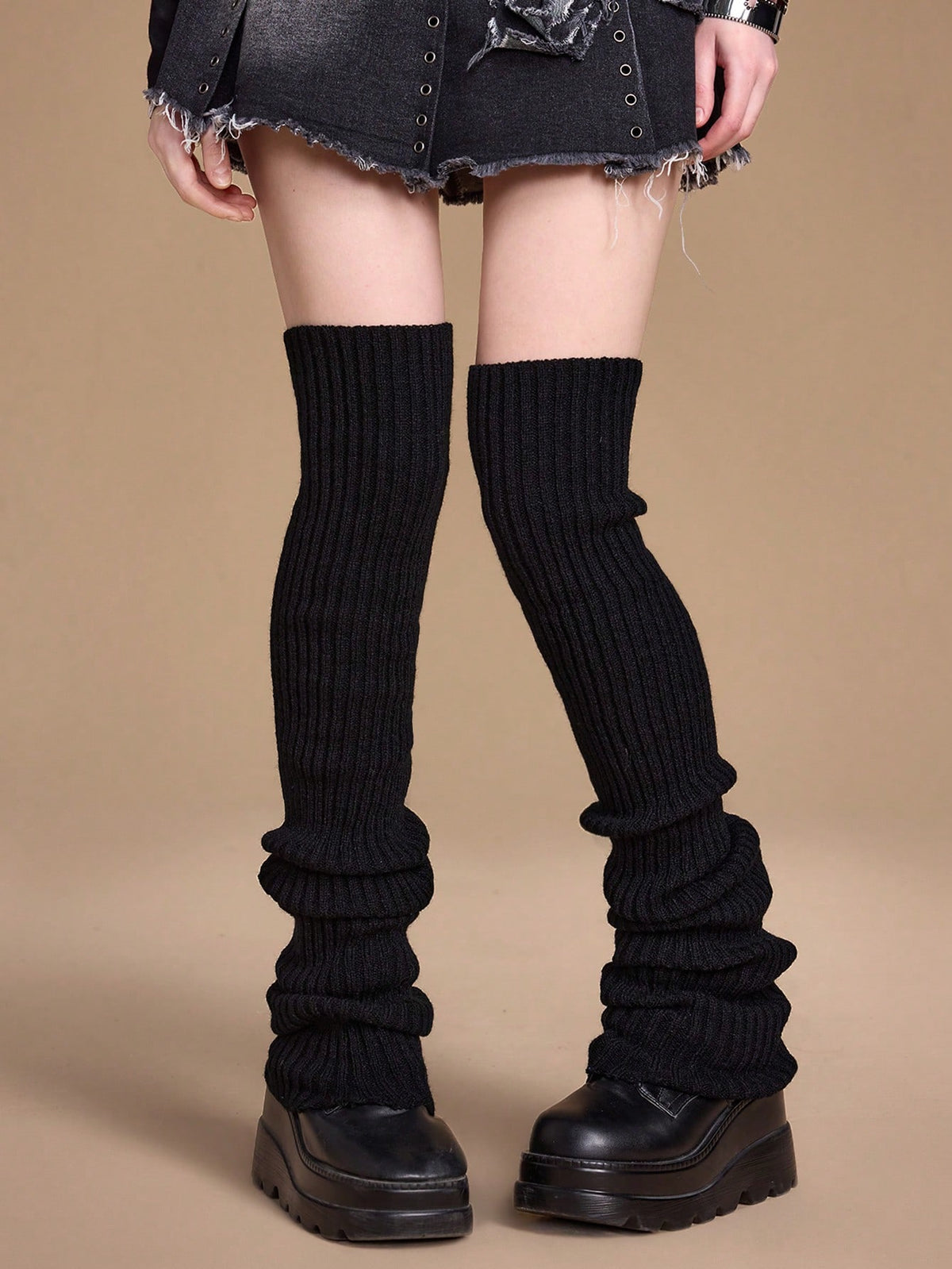 Pair of women's extra long knitted leg warmers featuring a gothic grunge design with subtle ruffle detailing.