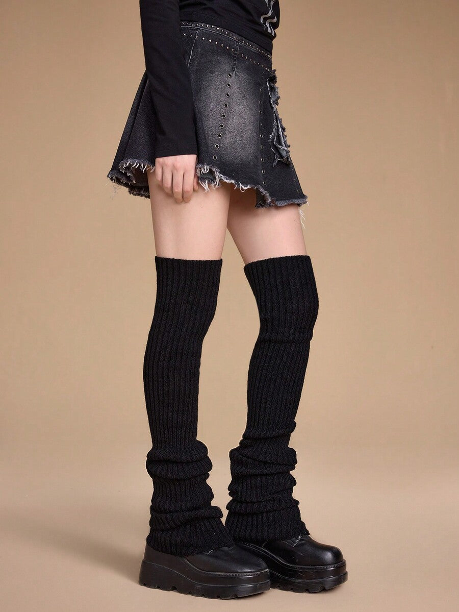 Pair of women's extra long knitted leg warmers featuring a gothic grunge design with subtle ruffle detailing.