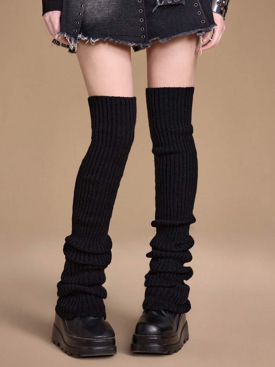 Pair of women's extra long knitted leg warmers featuring a gothic grunge design with subtle ruffle detailing.