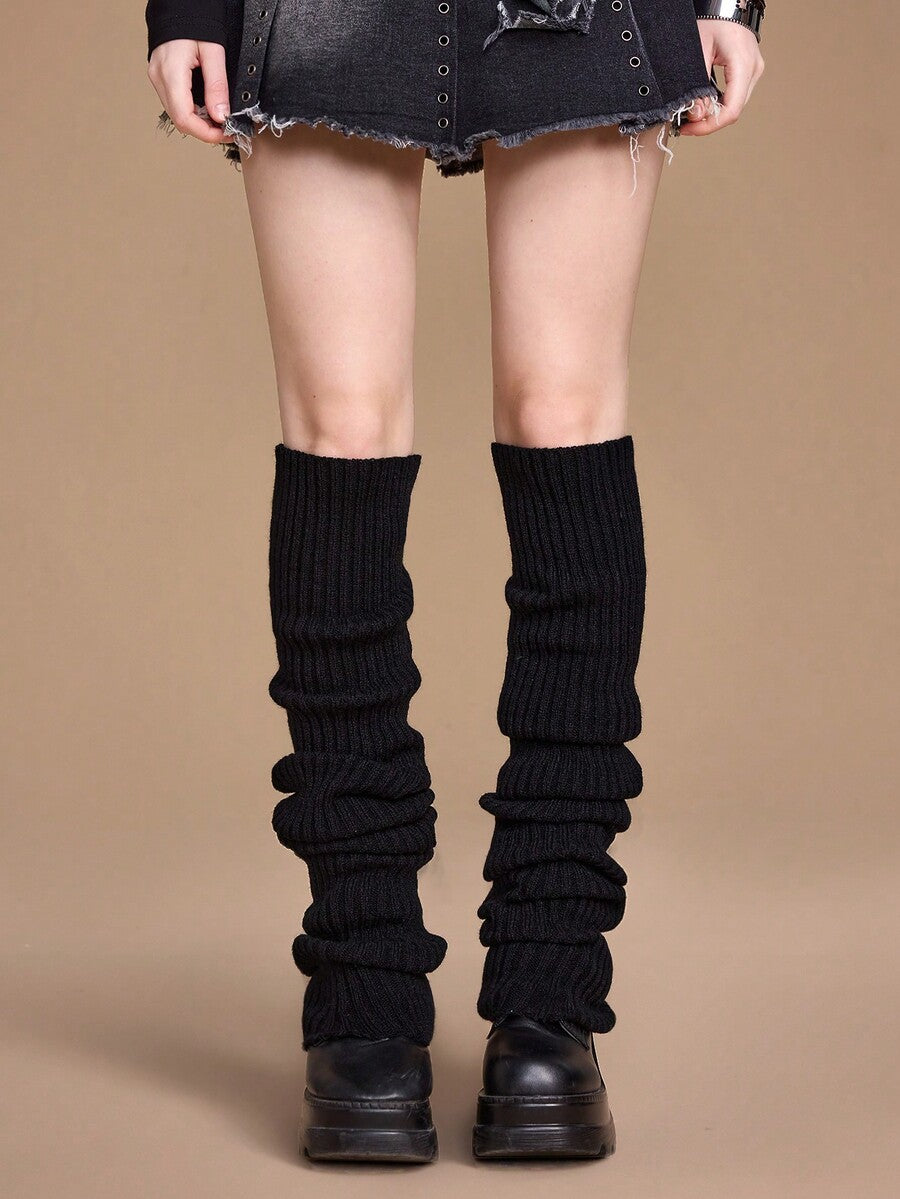 Pair of women's extra long knitted leg warmers featuring a gothic grunge design with subtle ruffle detailing.