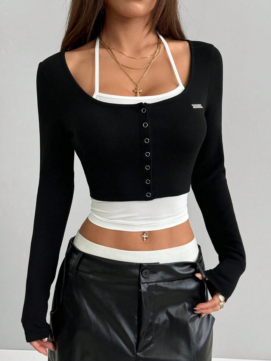 Women's black and white cropped Y2K-style top with lace-up camisole look, halter neckline, long sleeves, button front, rib-knit texture, and slim fit