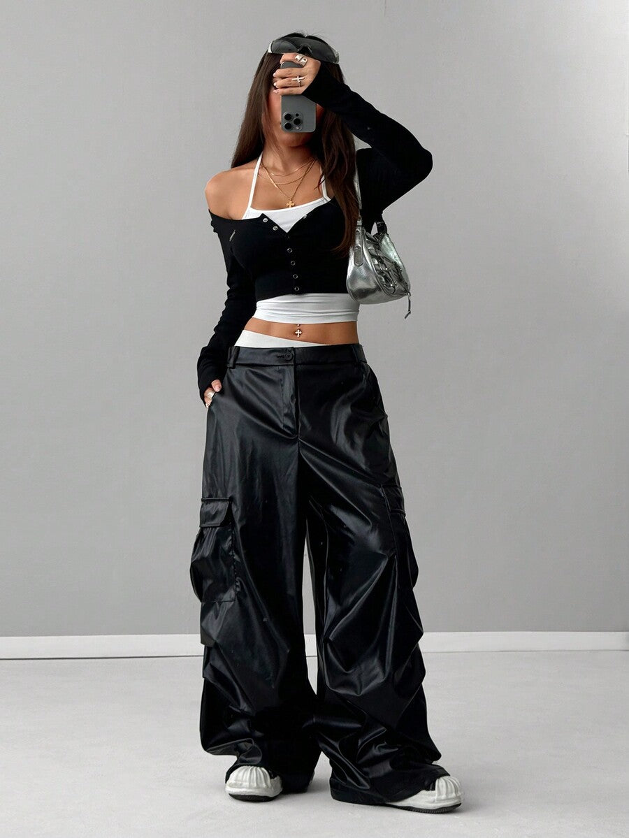 Women's black and white cropped Y2K-style top with lace-up camisole look, halter neckline, long sleeves, button front, rib-knit texture, and slim fit