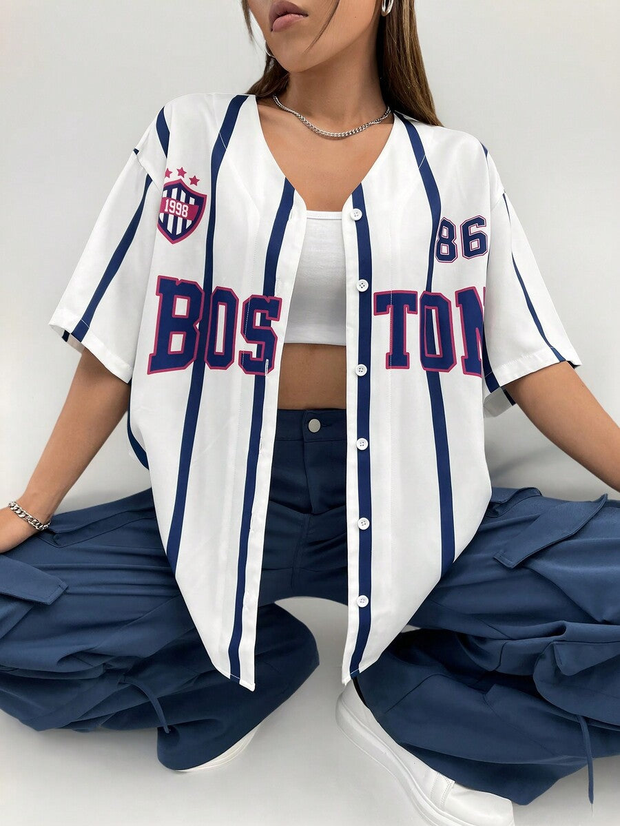 Women's white striped baseball jersey shirt with letter graphic, button-down front, and drop shoulder half sleeves.