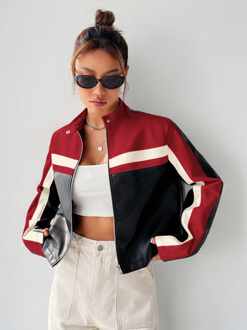 Women's black striped zip up crop jacket featuring a stand collar and long regular sleeves.