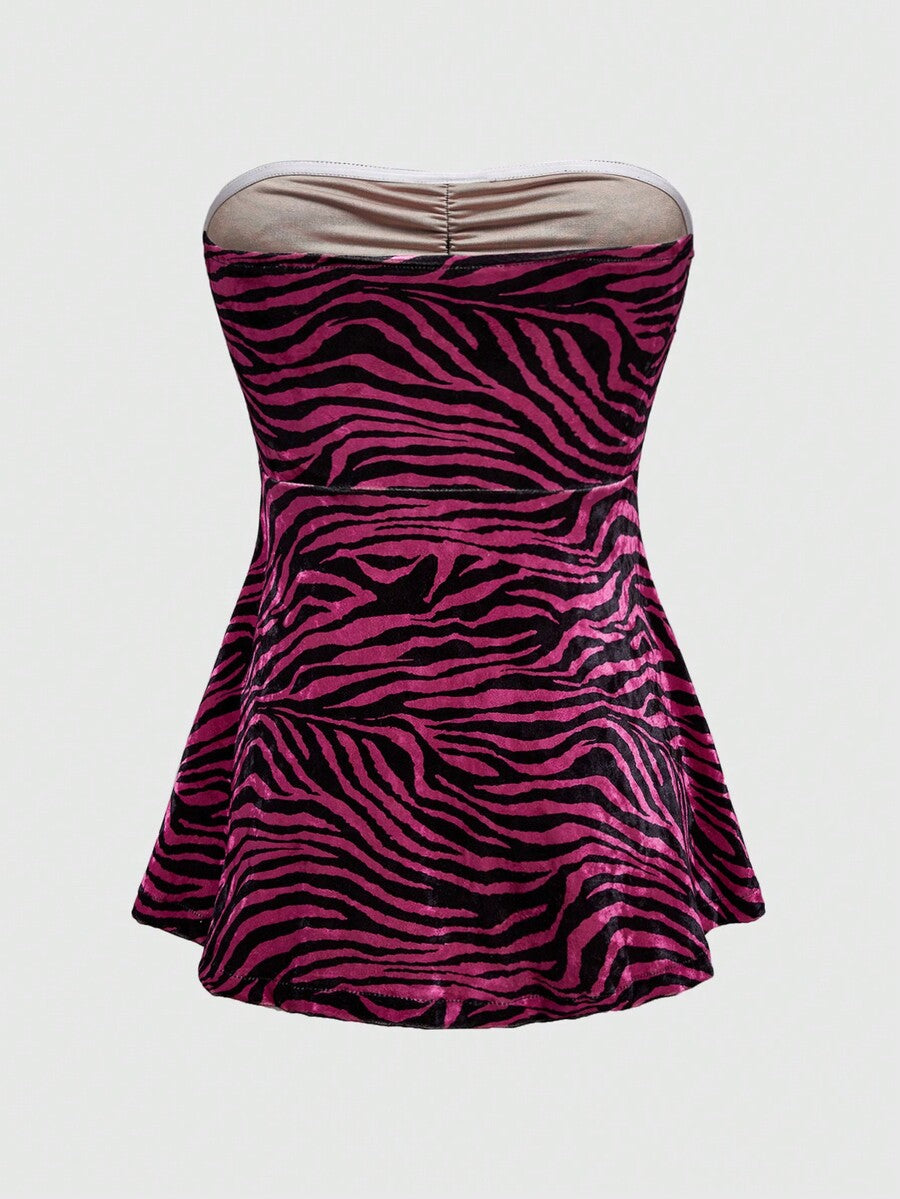 Women's strapless hot pink zebra print ruched tube top featuring a flared hem and slim fit knitted fabric.