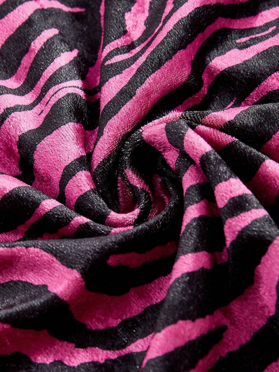 Women's strapless hot pink zebra print ruched tube top featuring a flared hem and slim fit knitted fabric.