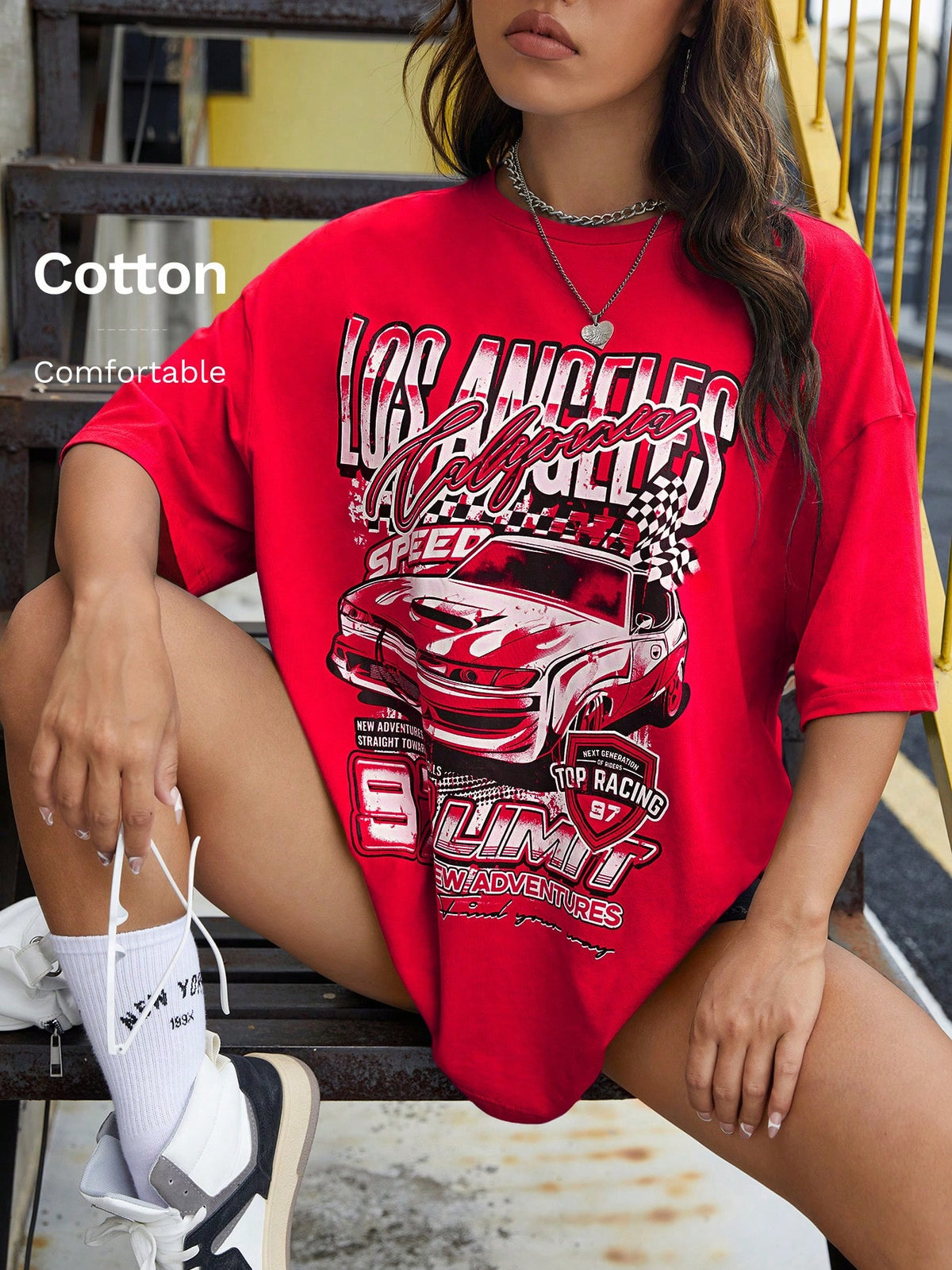 Red oversized t-shirt with letter graphic print and drop shoulder half sleeves.