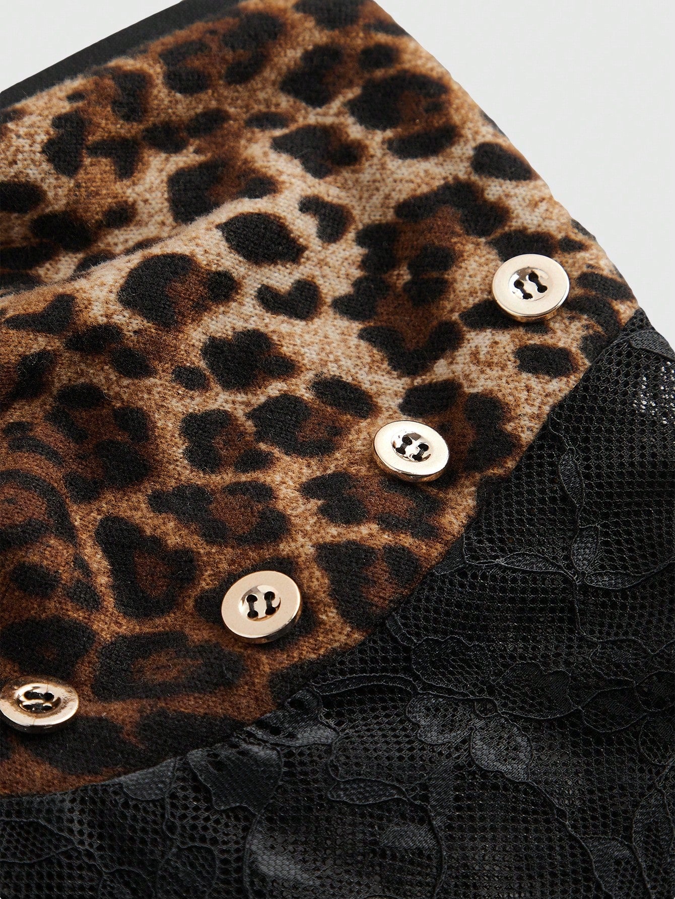 Brown leopard print Y2K halter crop tank top with lace detail, cross decor, backless knot design, and asymmetrical hem
