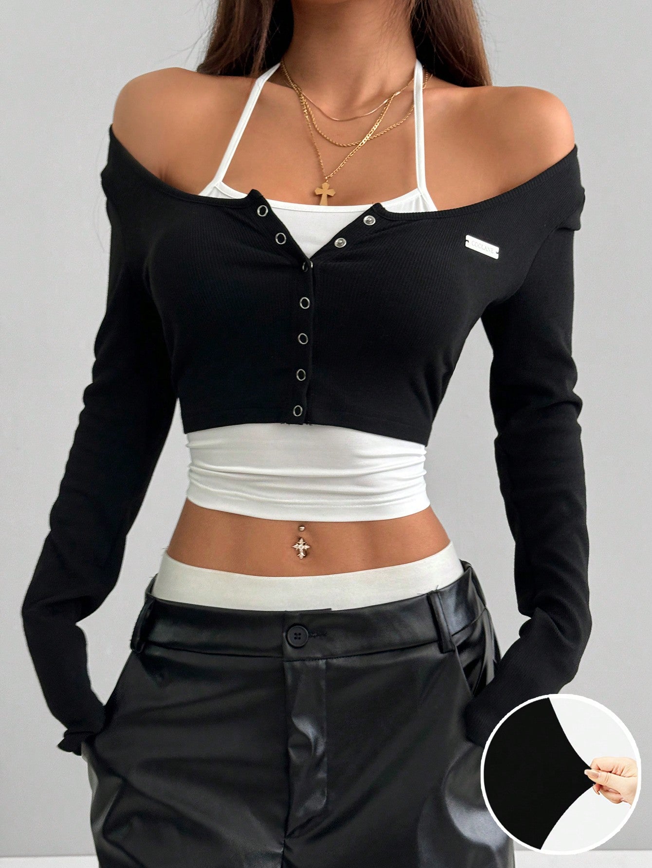 Women's black and white cropped Y2K-style top with lace-up camisole look, halter neckline, long sleeves, button front, rib-knit texture, and slim fit