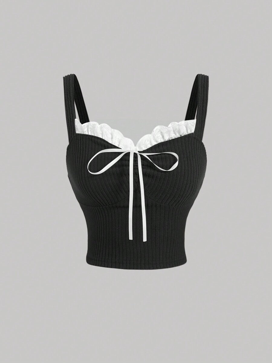 Black crop camisole top for women featuring shoulder straps, cold shoulder sleeves, drawstring detail, and frill trim on plain knitted fabric.