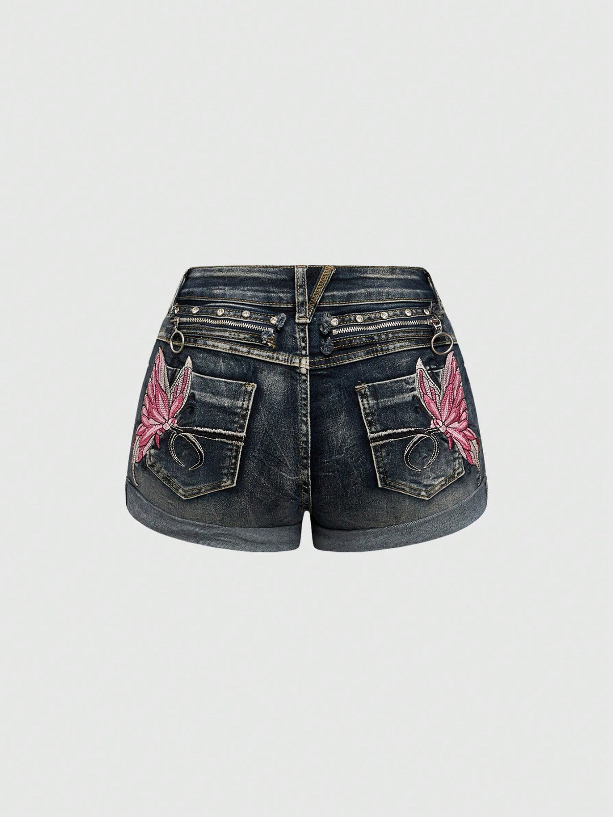 Blue washed shorts with butterfly embroidery, distressed detailing, ultra low waist, button closure, zipper fly, and pockets.