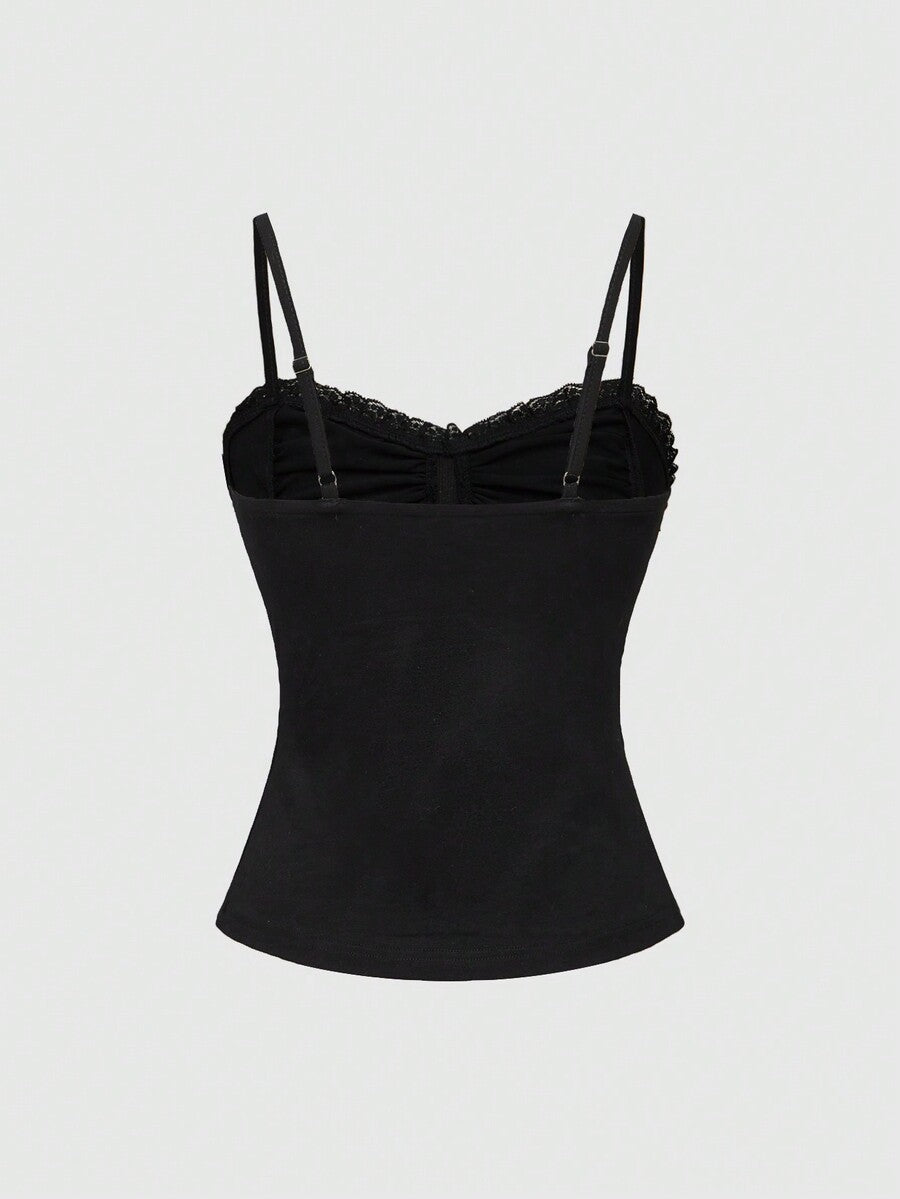 Black gothic spaghetti strap tank top for women featuring contrast lace patchwork, ruched frill details, and a cross pendant accent in a slim fit knitted fabric.