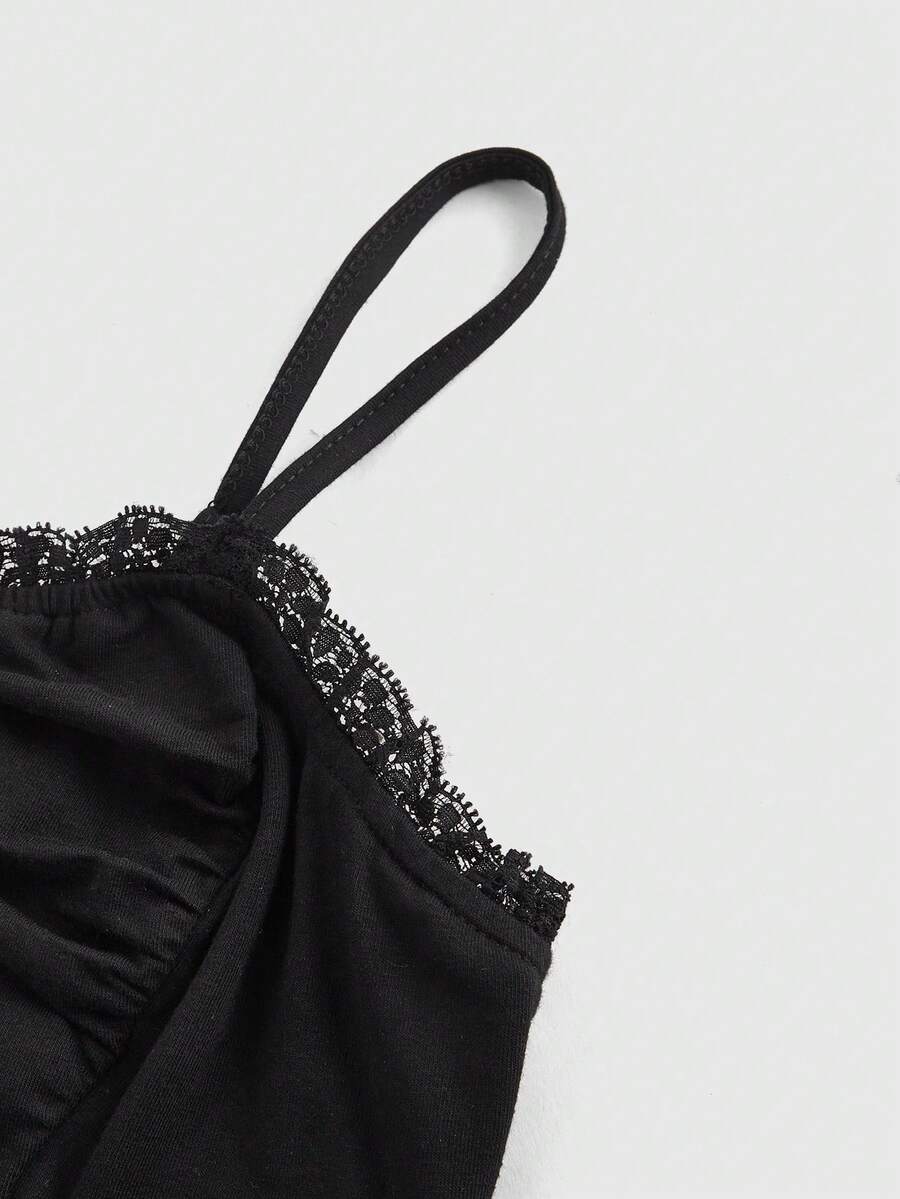 Black gothic spaghetti strap tank top for women featuring contrast lace patchwork, ruched frill details, and a cross pendant accent in a slim fit knitted fabric.