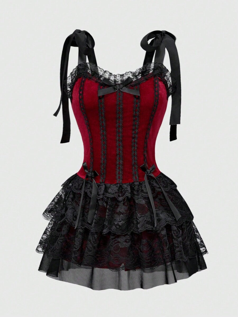 Gothic velvet halter mini dress with contrast lace trim, bow detail, lace-up accents, arm sleeves, layered hem, and cross pendant.
