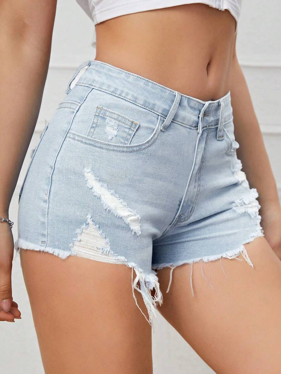 Women's solid color shorts with zipper fly, button closure, pockets, ripped details, and raw hem in a casual straight-leg short length