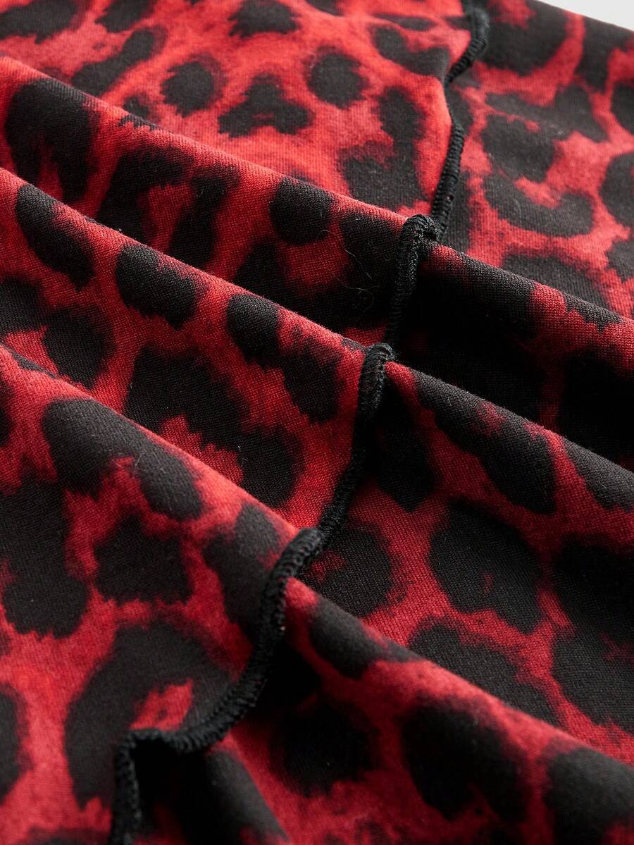 Y2K Harajuku goth style leopard print halter mini dress with backless cut-out details, high waist, sleeveless slim fit, and layered tiered hem.
