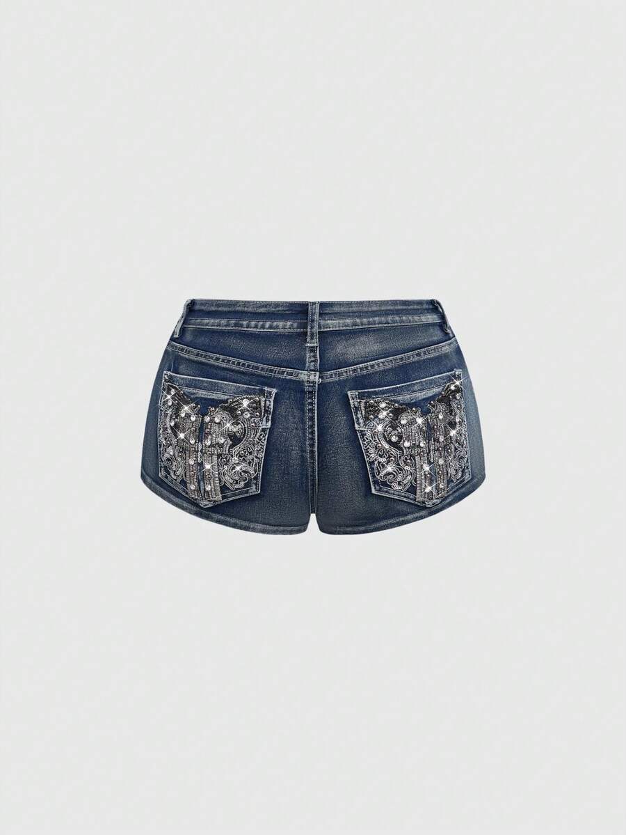 Women's ultra low waist skort with mini shorts length, zipper fly, pockets, pistol embroidery, and rhinestone details
