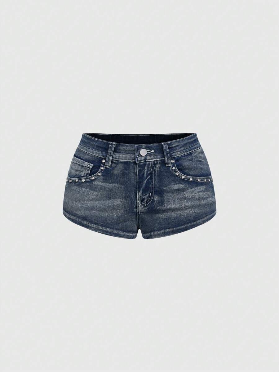 Women's ultra low waist skort with mini shorts length, zipper fly, pockets, pistol embroidery, and rhinestone details