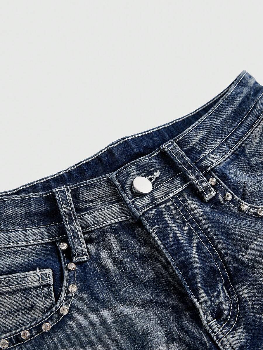 Women's ultra low waist skort with mini shorts length, zipper fly, pockets, pistol embroidery, and rhinestone details