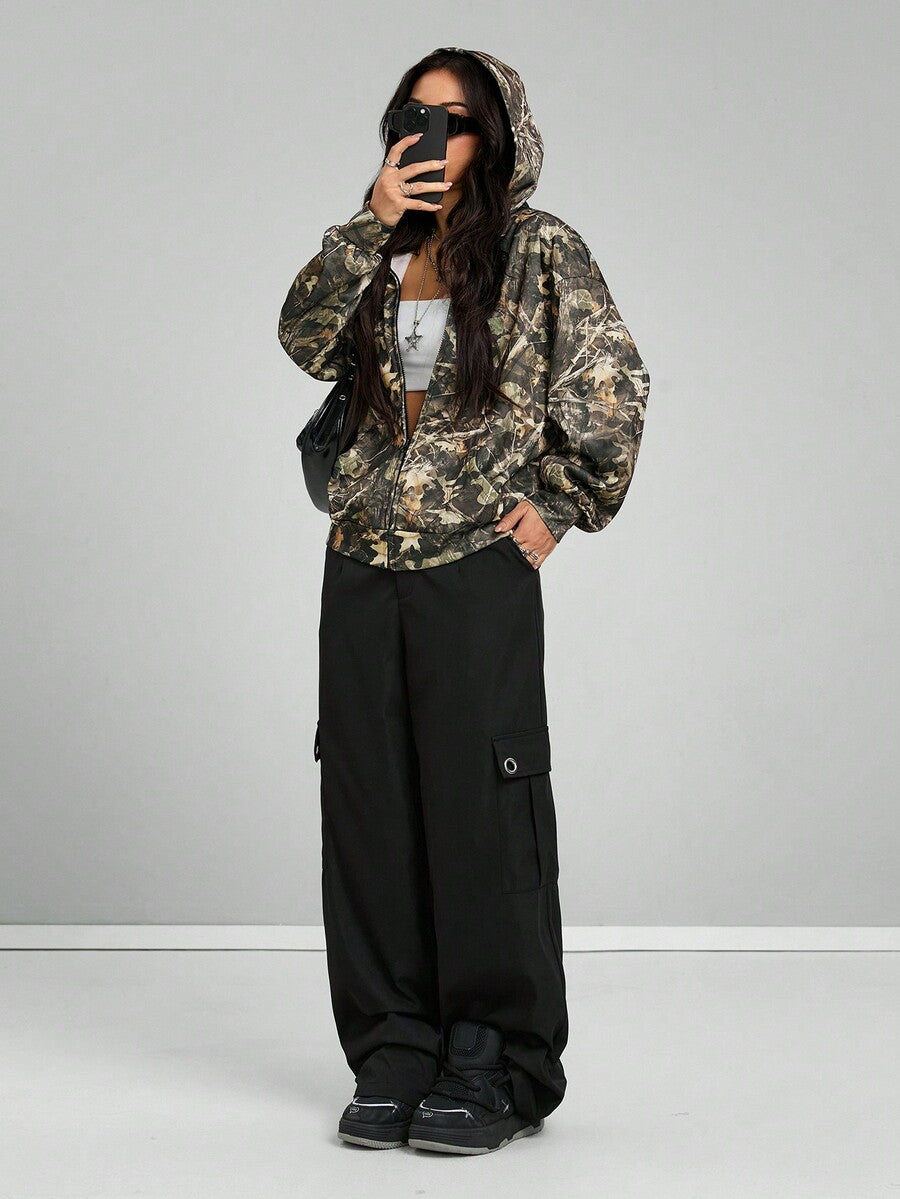 Women's army green camo zip up hoodie with drop shoulder sleeves, front pockets, and drawstring hood