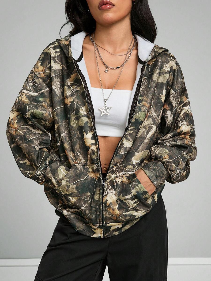 Women's army green camo zip up hoodie with drop shoulder sleeves, front pockets, and drawstring hood