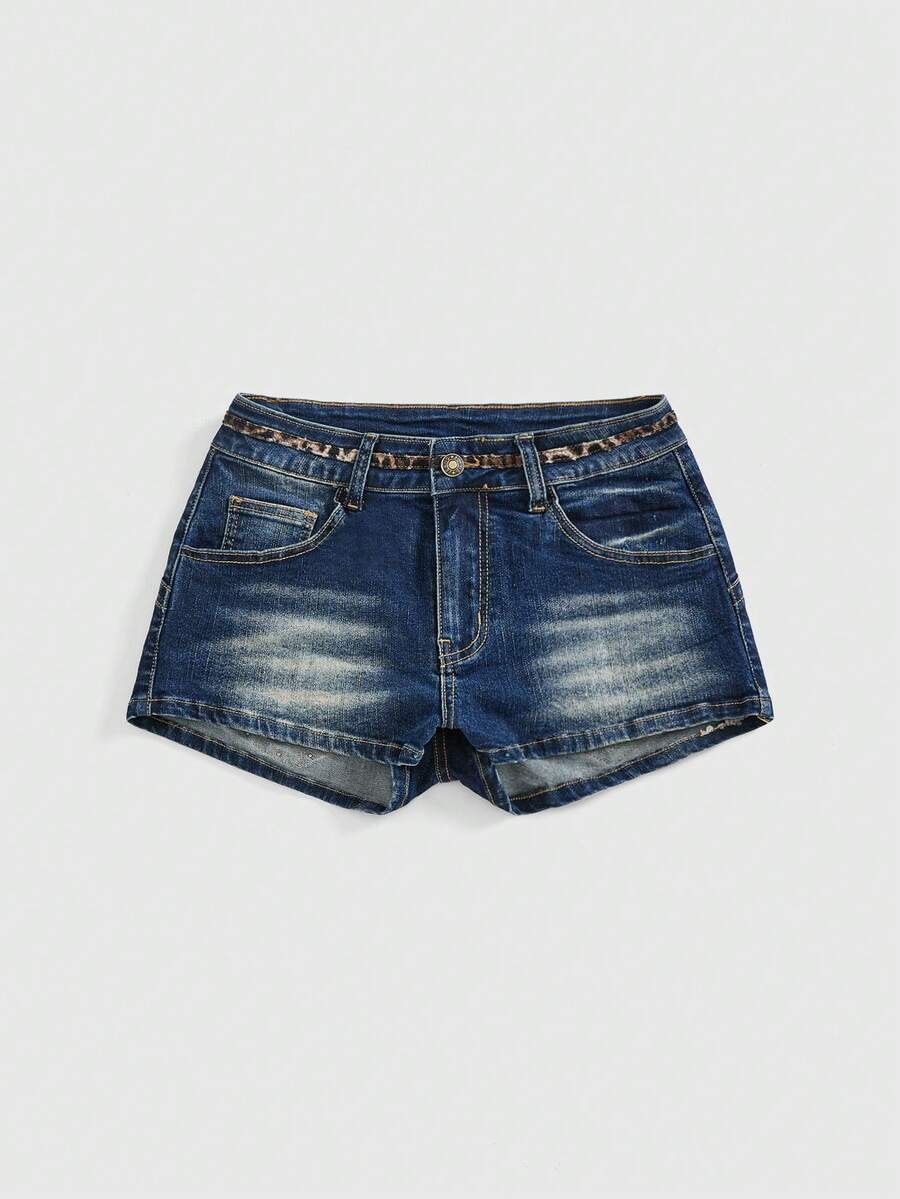 Women's super low waist shorts with leopard print embroidery, button and zipper closure, and raw hem detailing.