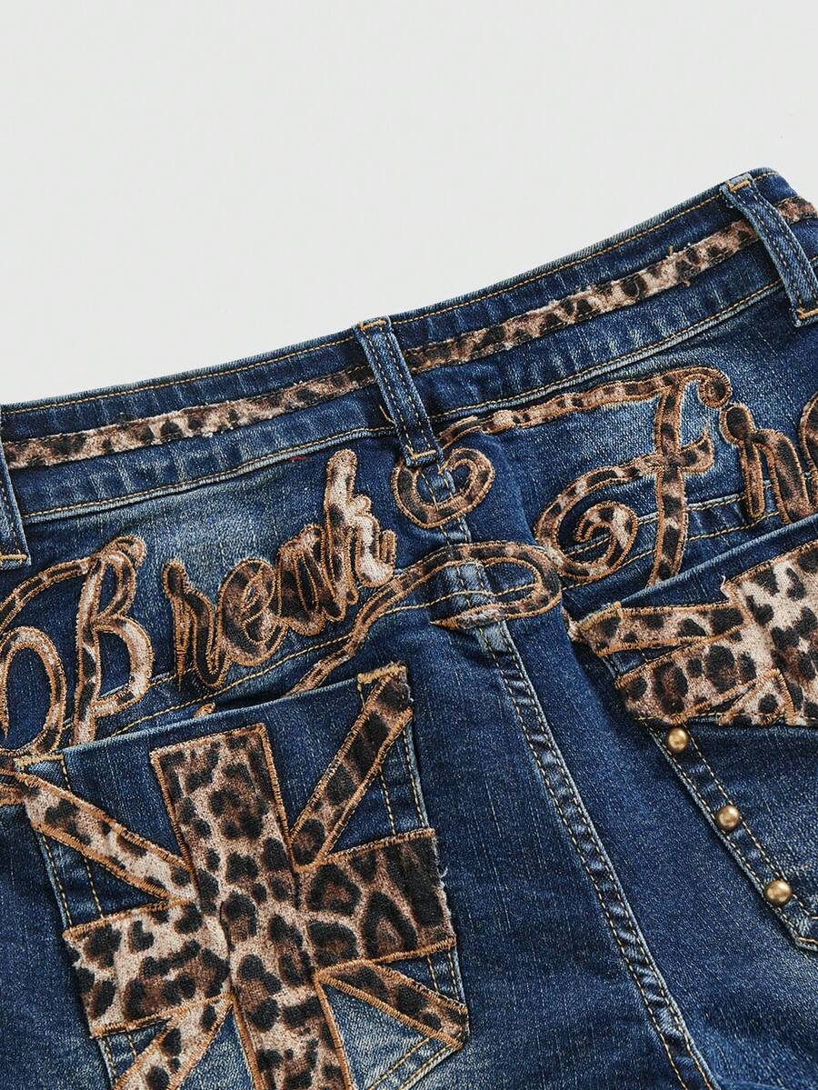 Women's super low waist shorts with leopard print embroidery, button and zipper closure, and raw hem detailing.