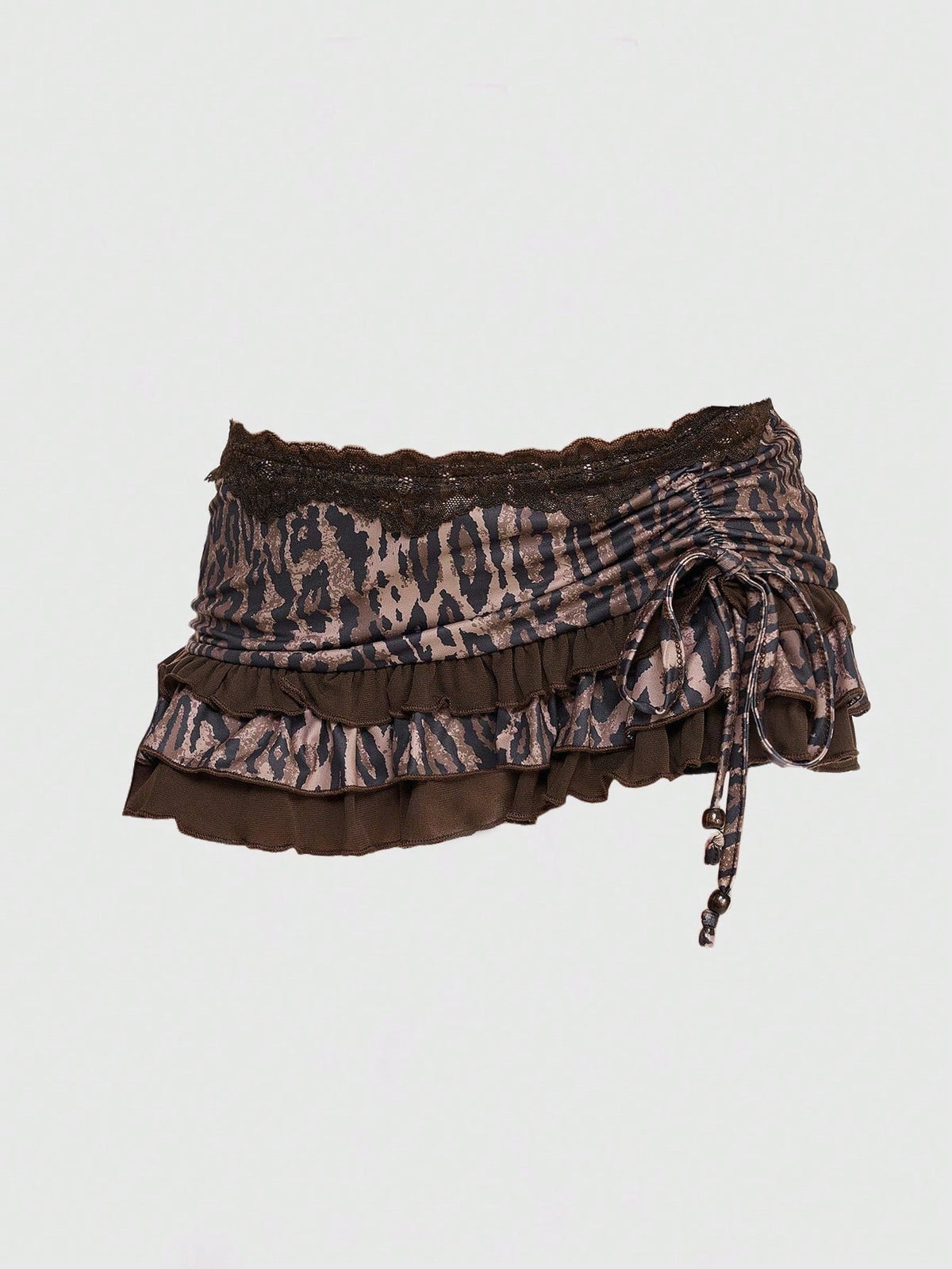 Women's black low-waist mini skirt with drawstring tie, ruched details, lace trim, layered ruffle hem, and asymmetric styling
