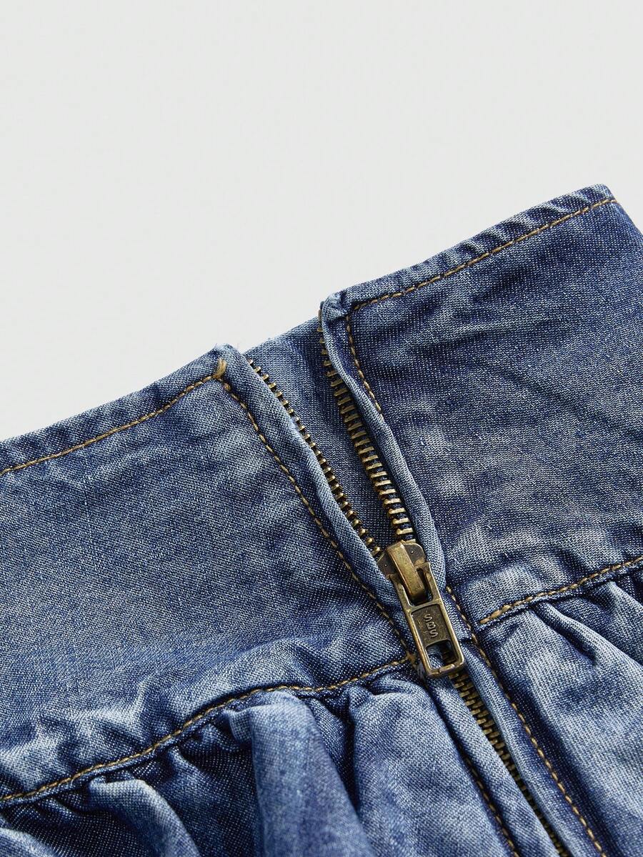 Y2K ultra low waist mini skirt with tiered layer detail, ruffle hem, zipper closure, straight silhouette, and fabric.