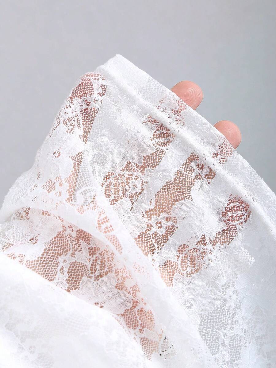 Women's solid lace halter top featuring a backless slim fit design with semi-sheer lace detail.