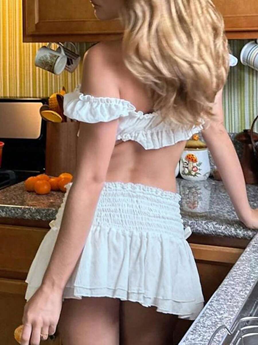 Women's Y2K off-shoulder short sleeve micro crop top with frill trim and ruched bust.