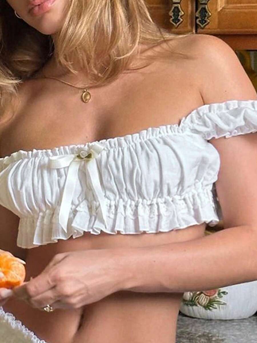 Women's Y2K off-shoulder short sleeve micro crop top with frill trim and ruched bust.