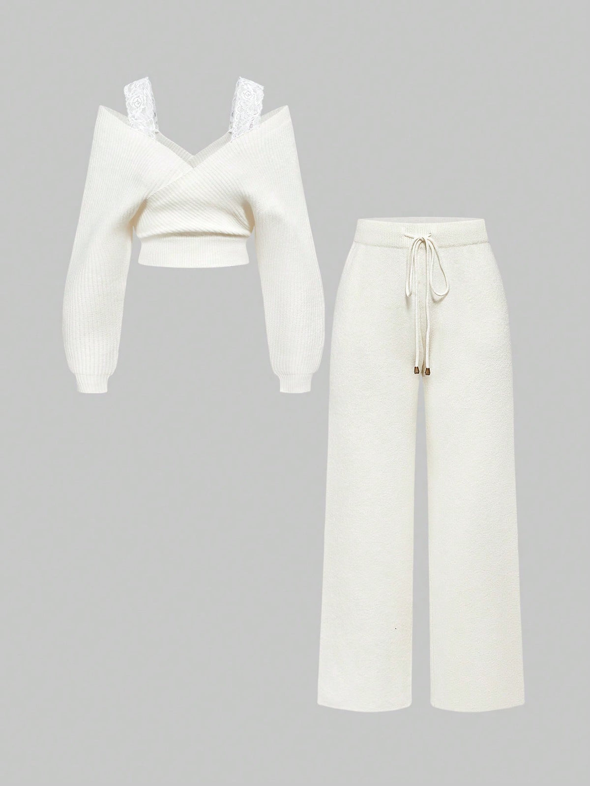 Women's two-piece rib-knit sweater set featuring a long-sleeve cold-shoulder crop top with strap details and matching wide-leg pants.