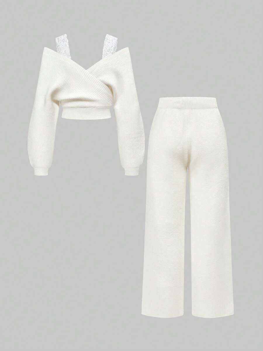 Women's two-piece rib-knit sweater set featuring a long-sleeve cold-shoulder crop top with strap details and matching wide-leg pants.
