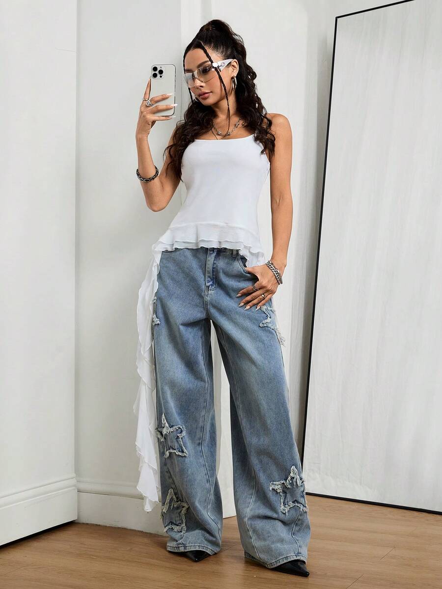 Front view of women's loose wide leg denim jeans featuring a mid waist, classic front pockets, and a zipper fly closure.