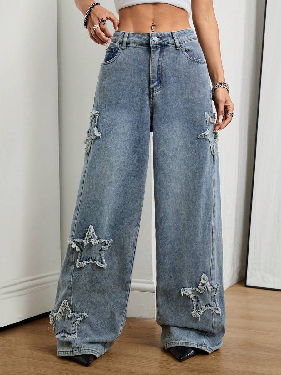Front view of women's loose wide leg denim jeans featuring a mid waist, classic front pockets, and a zipper fly closure.