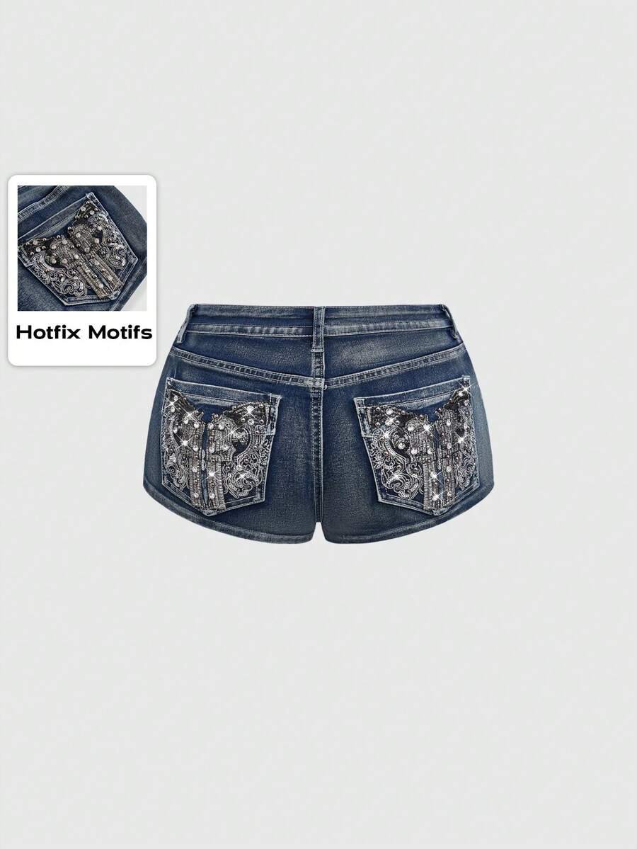 Women's ultra low waist skort with mini shorts length, zipper fly, pockets, pistol embroidery, and rhinestone details