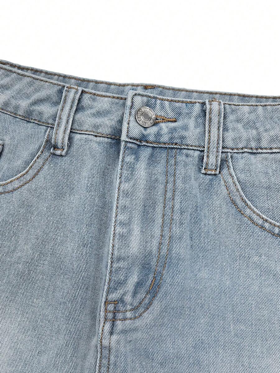 Y2K distressed mini skort with button and pocket details, natural mid waist, regular fit, and casual streetwear styling.